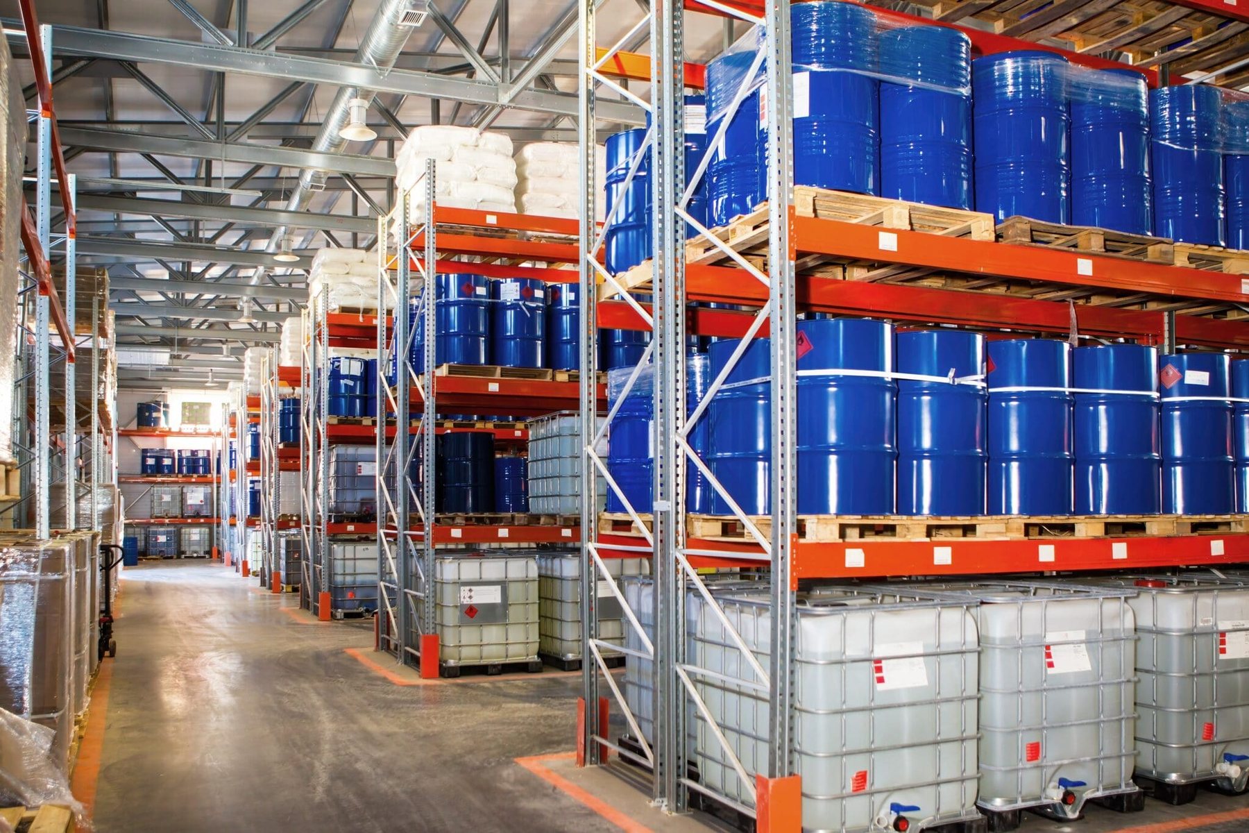 Warehouse with drums of industrial chemicals and solvents – Alzak Trading