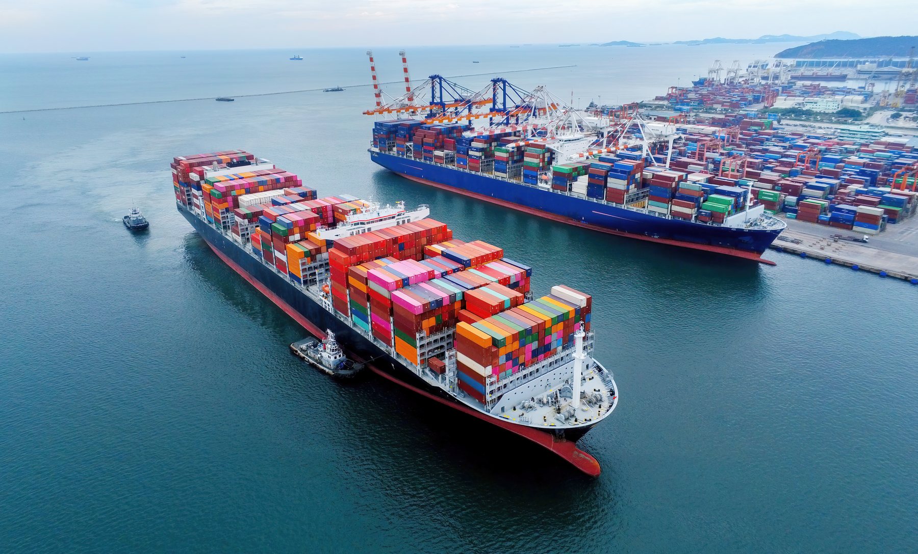 Container ships at a commercial port – Alzak Trading